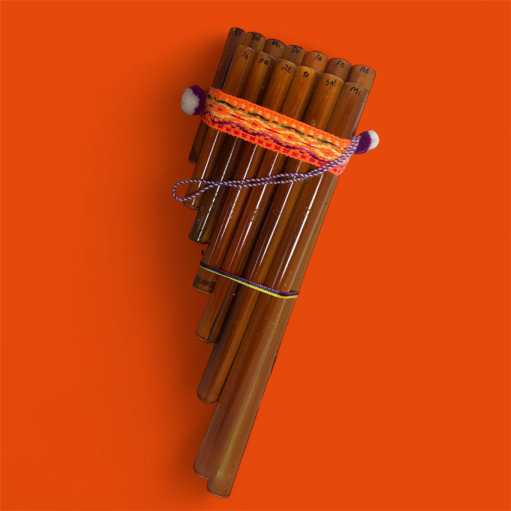 Woven pan flute instrument